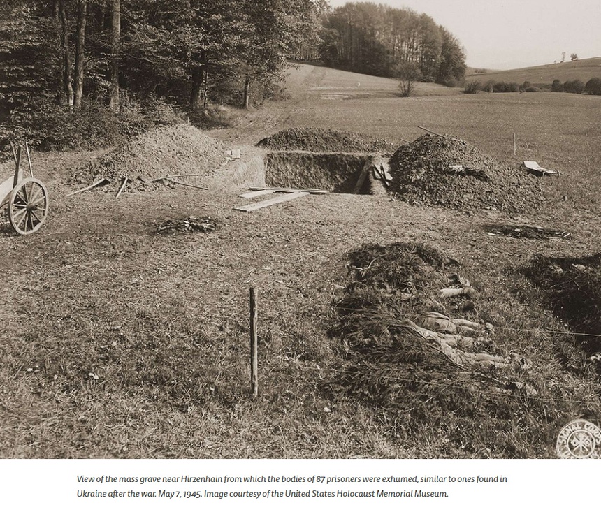 View of the mass grave near Hirzenhain from which the bodies of 87 prisoners were exhumed, similar to ones found in Ukraine after the war. May 7, 1945. Image courtesy of the United States Holocaust Memorial Museum.