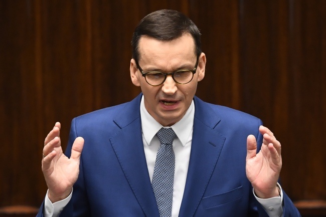 Premier RP Mateusz Morawiecki na sali plenarnej Sejmu, fot. PAP/Radek Pietruszka