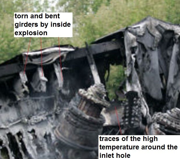 Fig. 5a Zoom showing inlet hole and marks of a high temperature around it. On the left at the top there are  remains of the torn