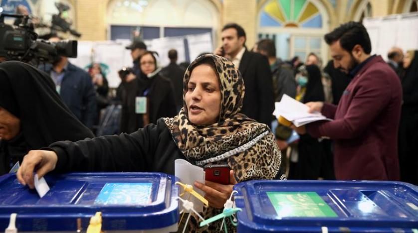 A woman casts her vote during parliamentary elections at a polling station in Tehran (File photo: Reuters)